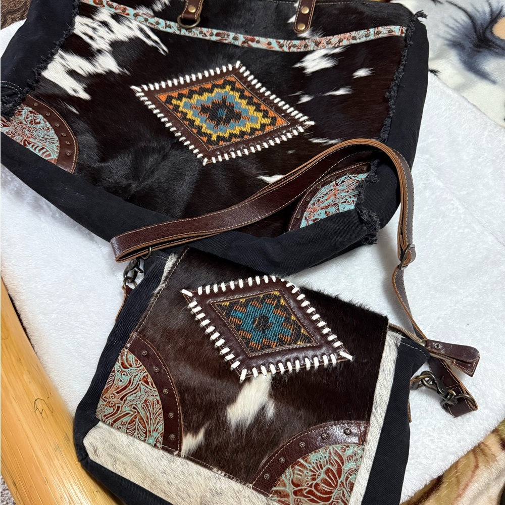 Set of two Myra bags, a weekender bag and a purse in good condition firm